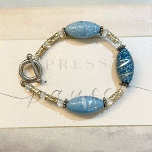 Handcrafted, blue bead and silver colored bracelet